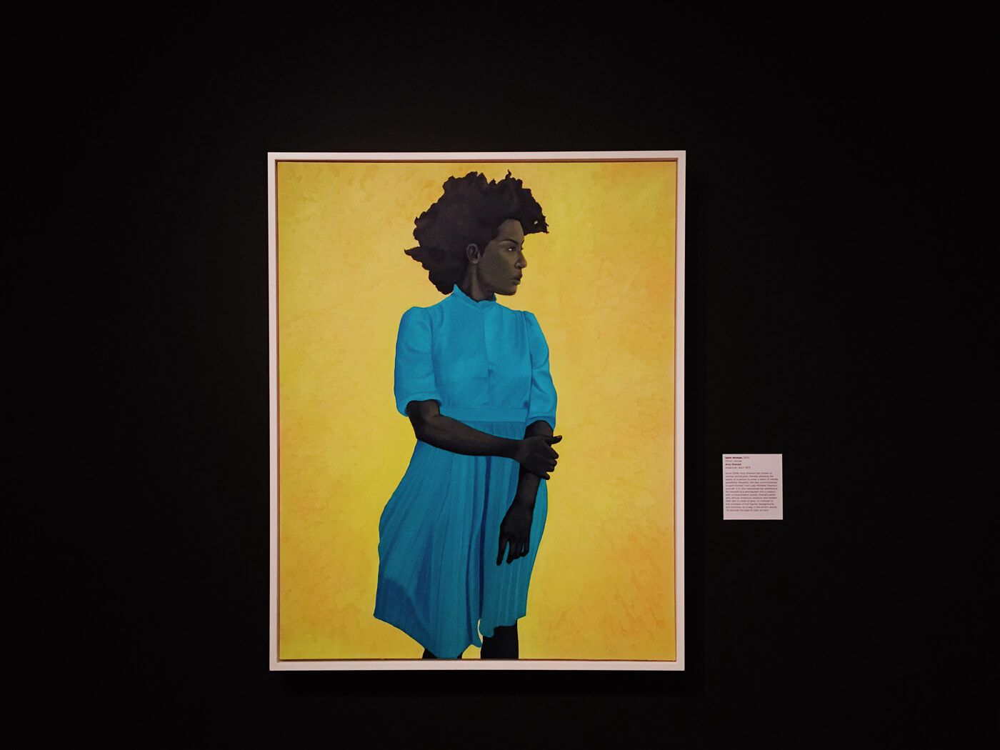Painting of a black woman in a blue dress