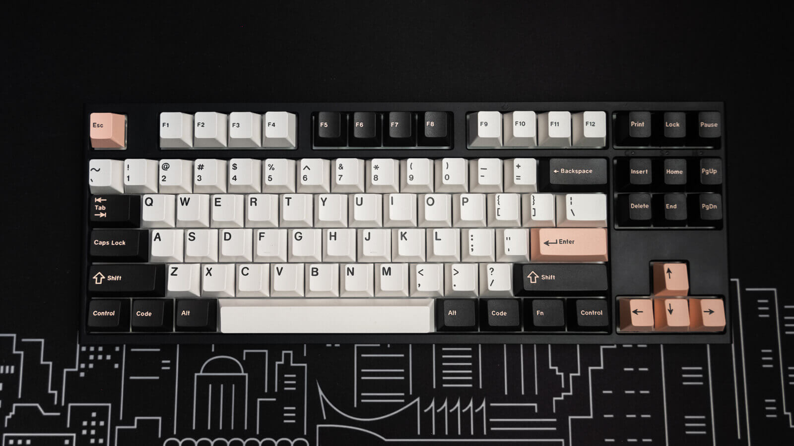 A regular keyboard with white, black, and pink keycaps.
