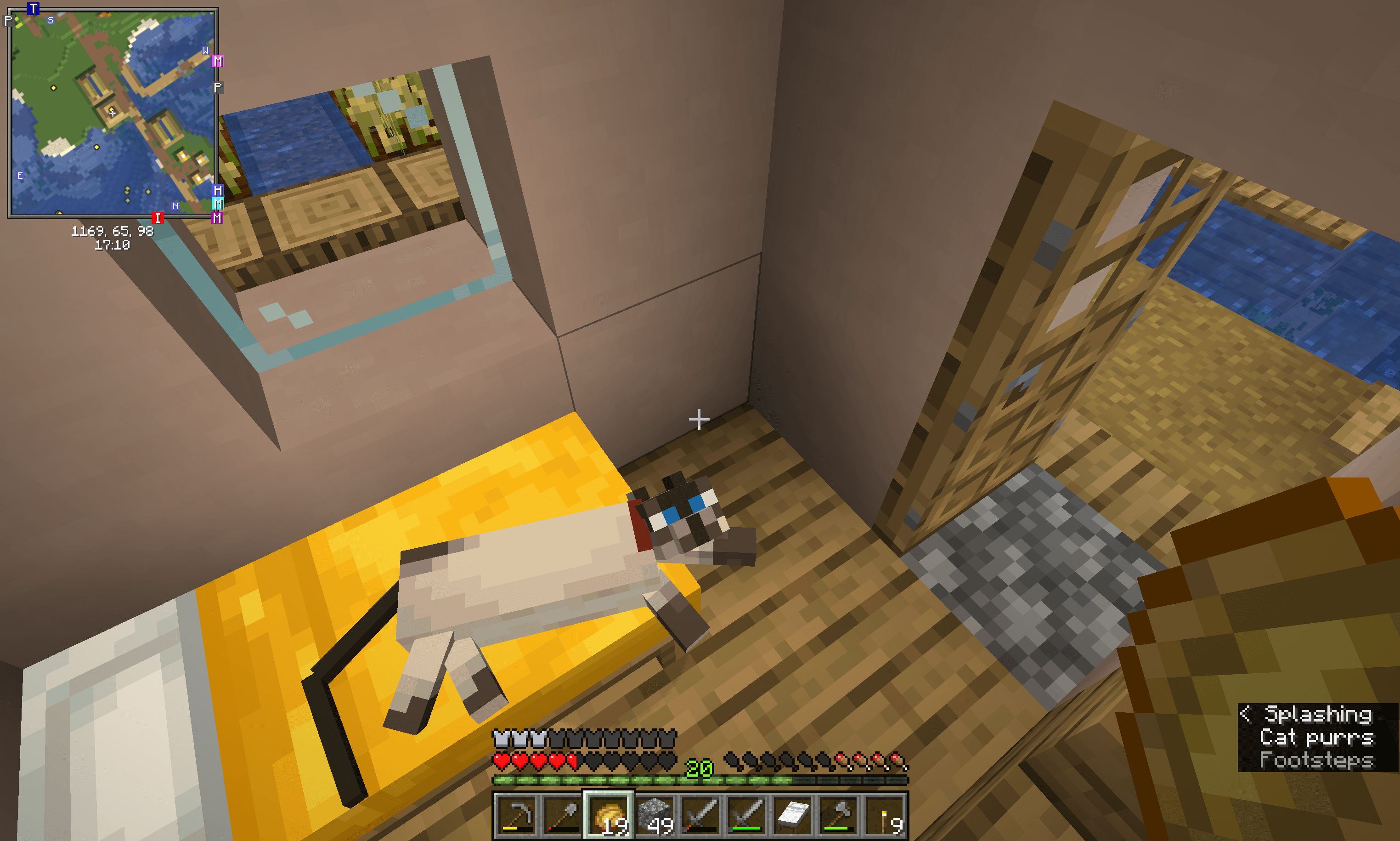 Minecraft screenshot of a cat lounging on a bed.