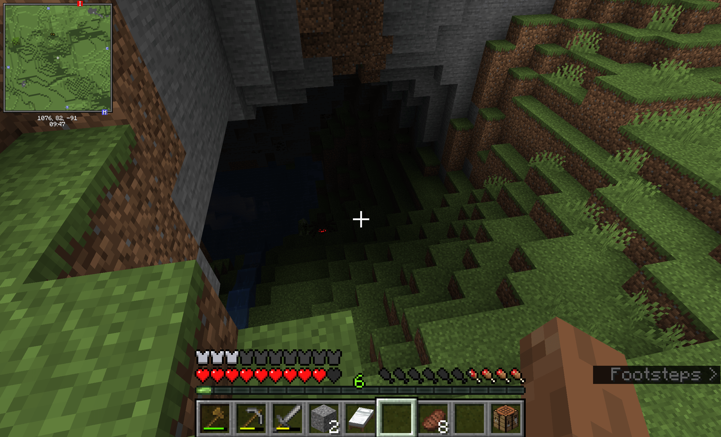 Minecraft screenshot looking down into a dark gave. In the darkness are the glowing red eyes of a spider monster.