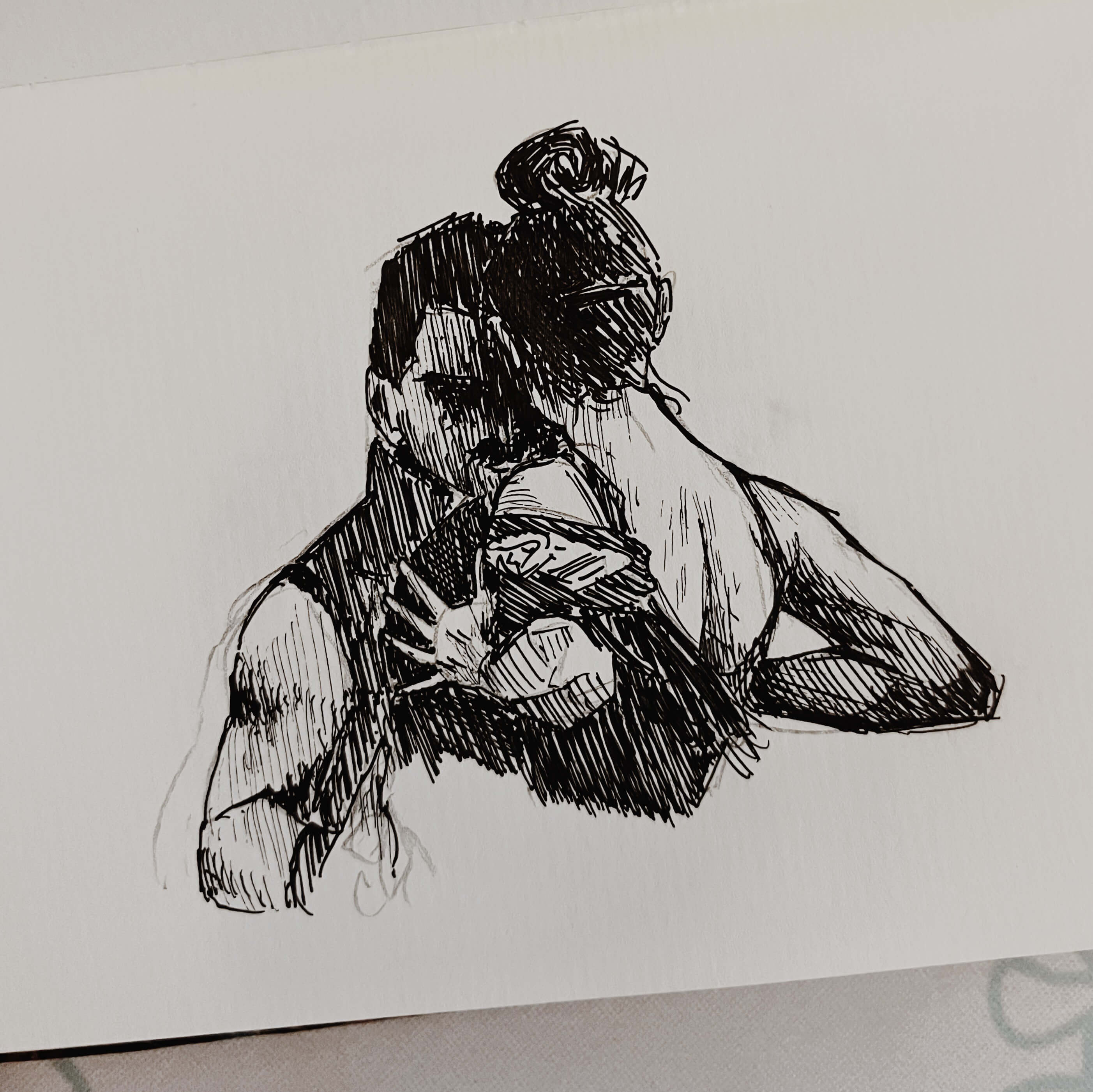 Ink sketch of two dancers standing against each other, faces close.