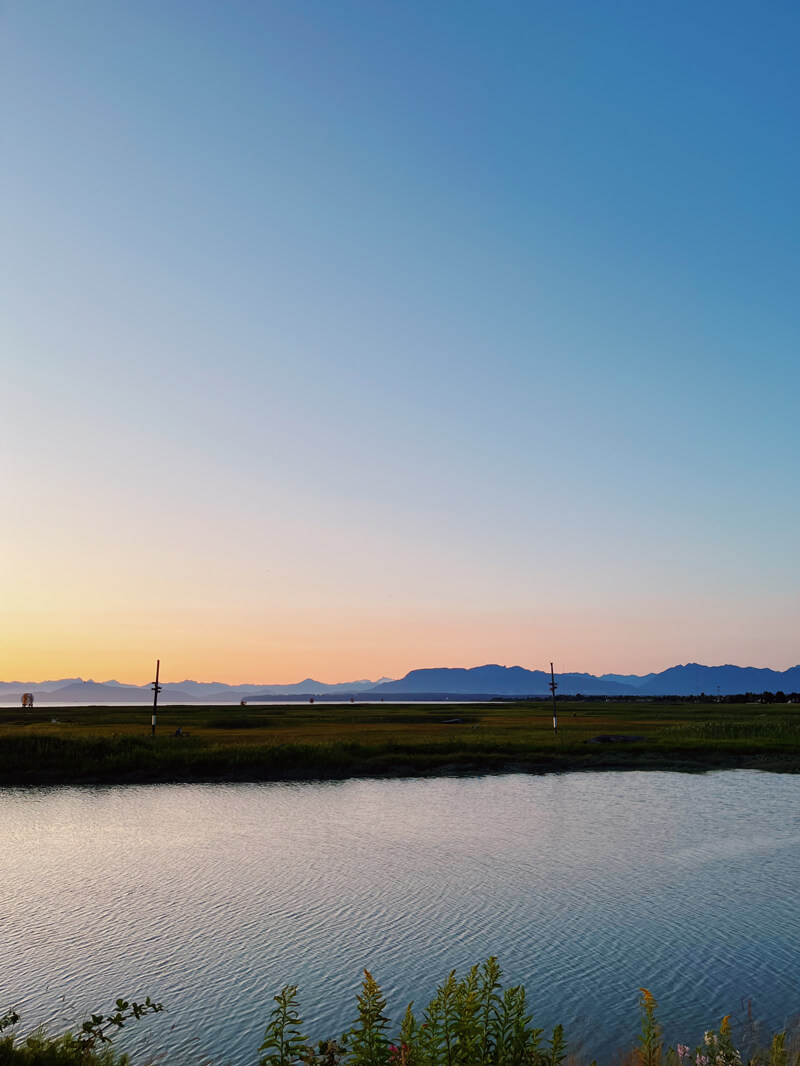 Another sunset view, now with far way mountains past the water.