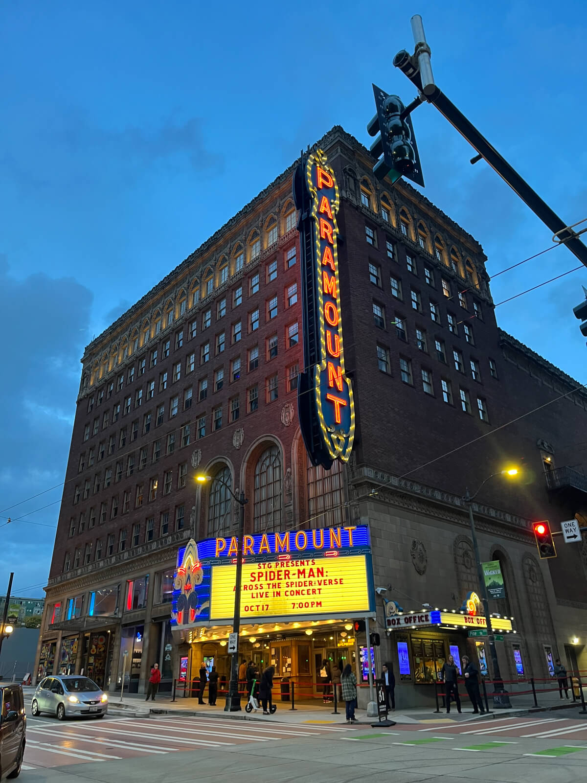 The neon sign of the Paramount theatre, which is showing Across the Spider-Verse live in concert.