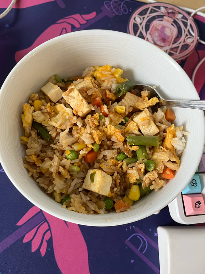 Fried rice in a round white bowl.