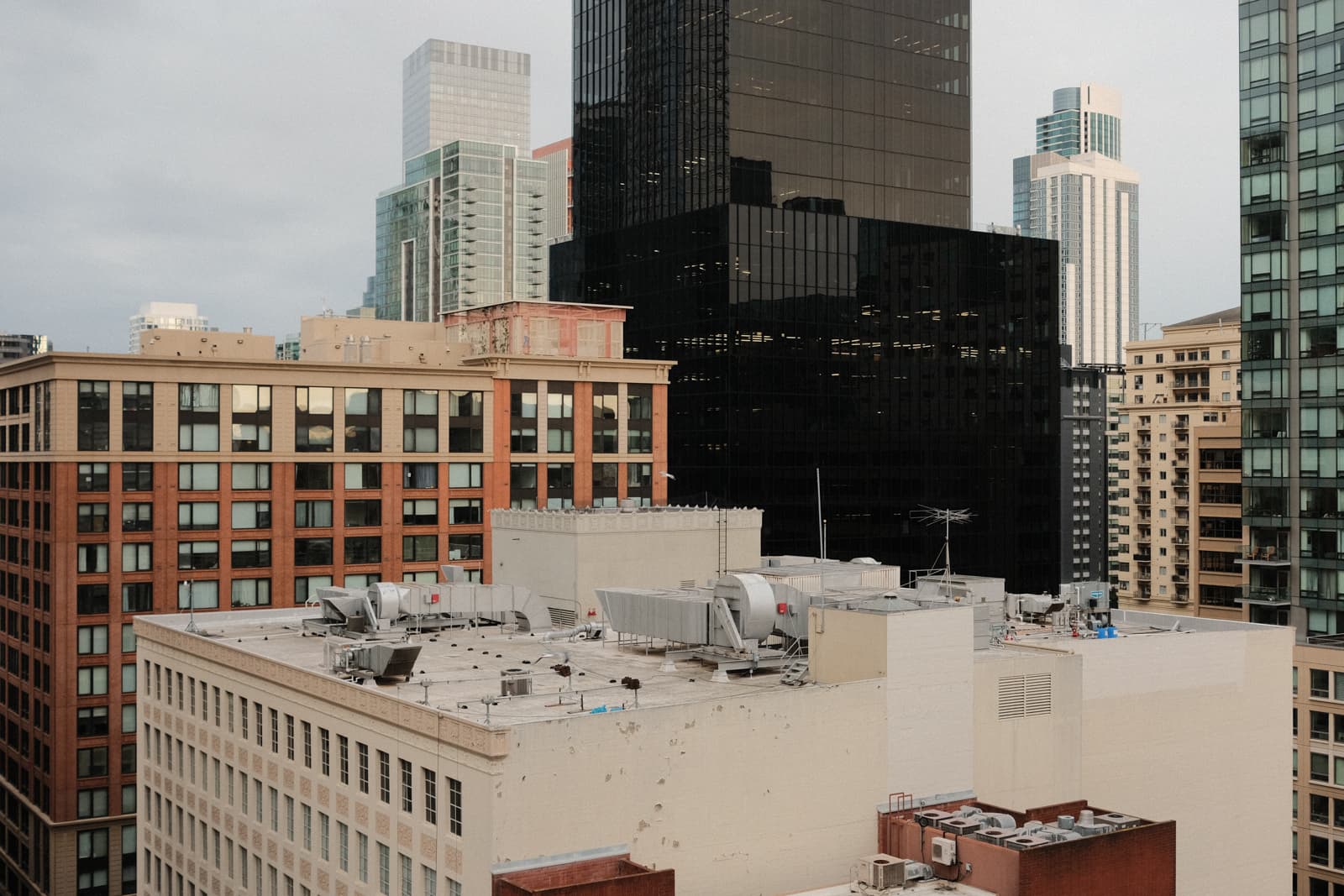 Tall downtown buildings and rooftops.