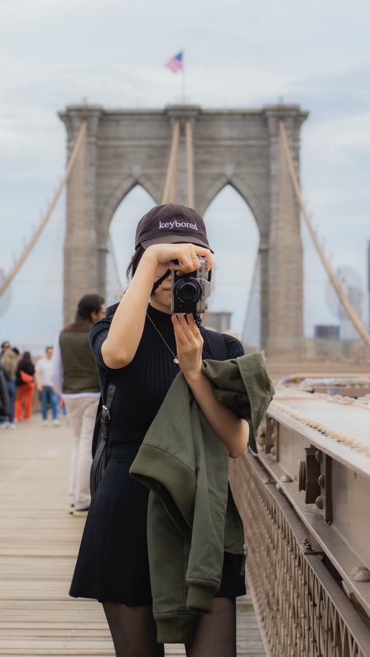 Me on the Brooklyn Bridge, taking a photo.