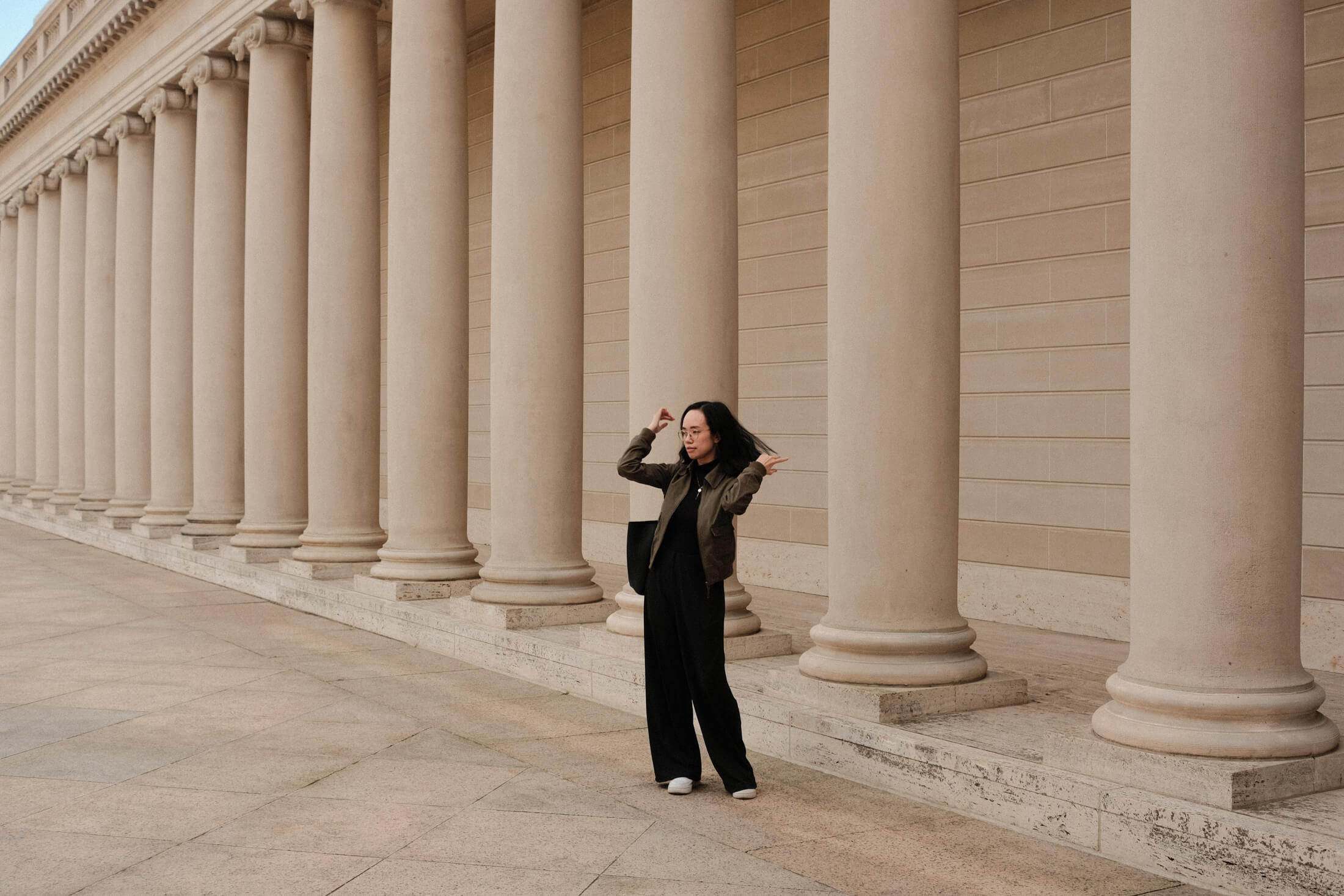 Me standing in front of some ionic columns, tossing my hair in a very casual, candid way.