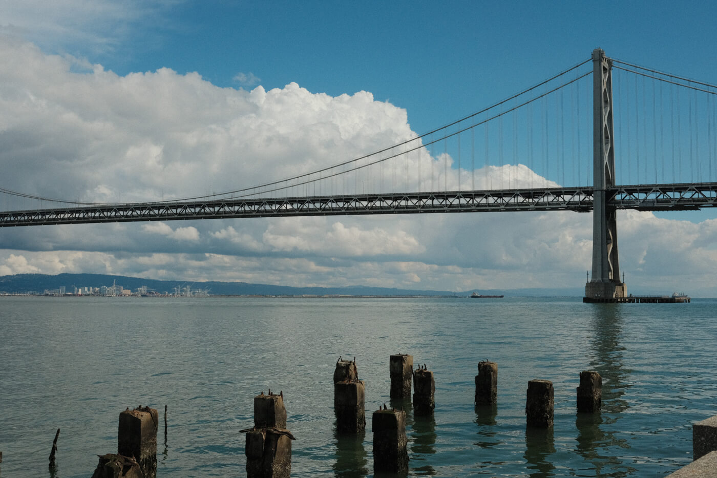 View of the Oakland Bay Bridge and the water.