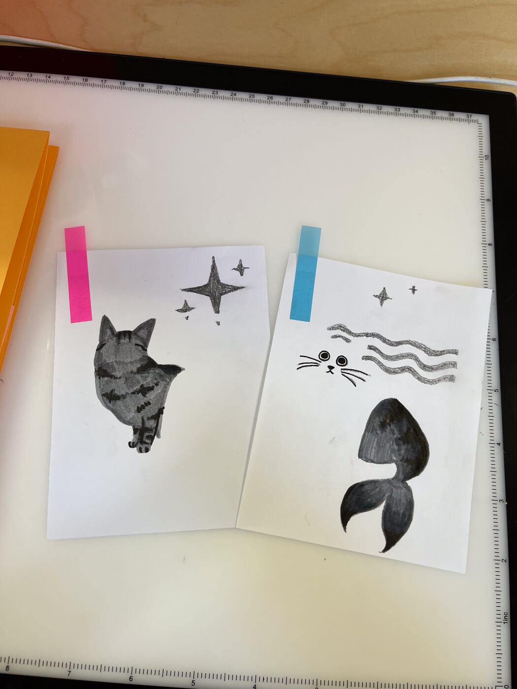 The two layers that make up the riso print, rendered in grey ink. One layer is the top half of Sophie's body; the other is the tail and her face.
